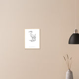 Heron line art framed print on a wall beside a black pendant lamp