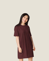 Margin Notes dress in Oxblood, worn, three-quarter view