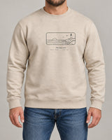 Coastline sweatshirt in Sand, worn by a model, studio photo
