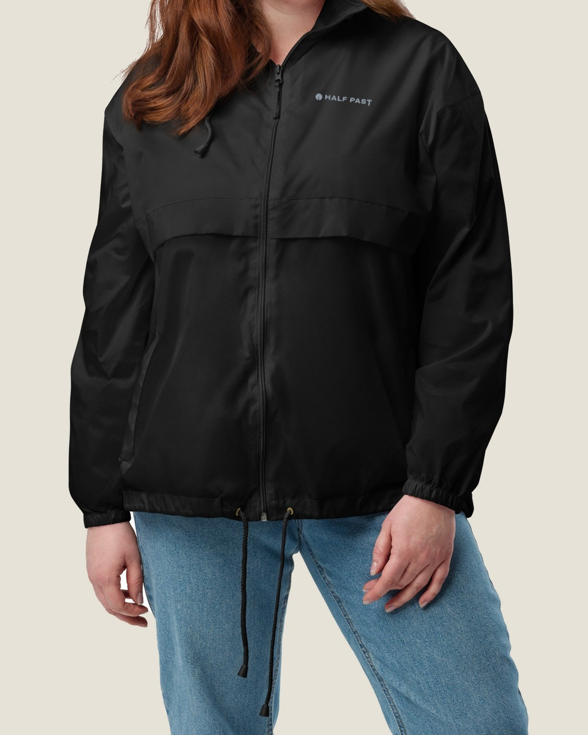Core windbreaker, black, worn by a model
