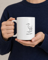Heron mug held in two hands
