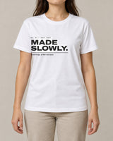 Made Slowly tee in White, worn by a model, studio photo