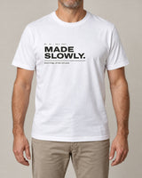 Made Slowly tee in White, worn by a model, studio photo