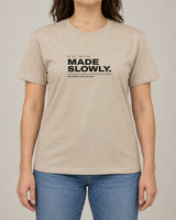 Made Slowly tee in Sand, worn by a model, studio photo