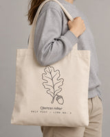 Oak Leaf tote in Natural, carried on the shoulder