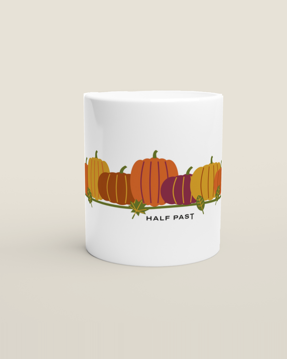 Pumpkin Patch mug, front: a row of autumn pumpkins with the Half Past wordmark