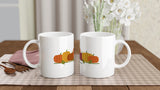 Two Pumpkin Patch mugs on a kitchen table, showing both sides of the pumpkin wrap