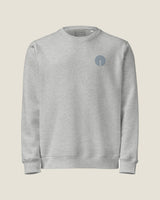 Core crew sweatshirt in Heather Grey, front view with the embroidered chest mark