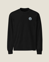 Core long-sleeve tee in Black, front view with the embroidered chest mark