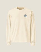 Core long-sleeve tee in Ecru, front view with the embroidered chest mark
