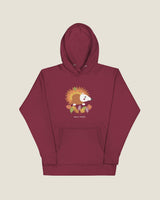 Hedgehog hoodie in Maroon: a hedgehog in autumn leaves, Half Past wordmark below