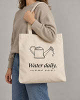 Water Daily tote in Natural, carried on the shoulder